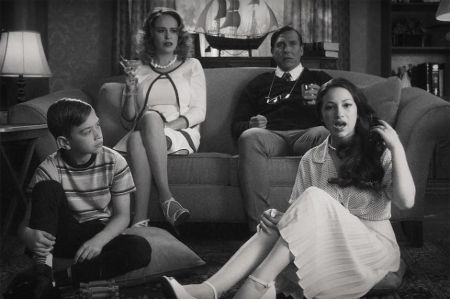 danielle in a black and white 80s setup with her reel life family 